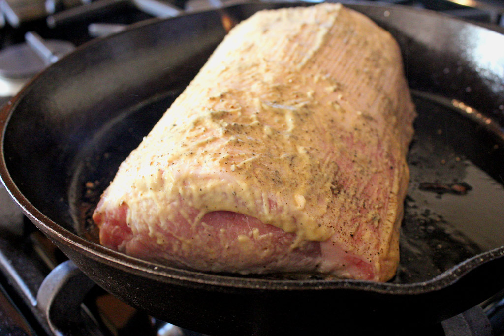 searing the roast in cast iron pan