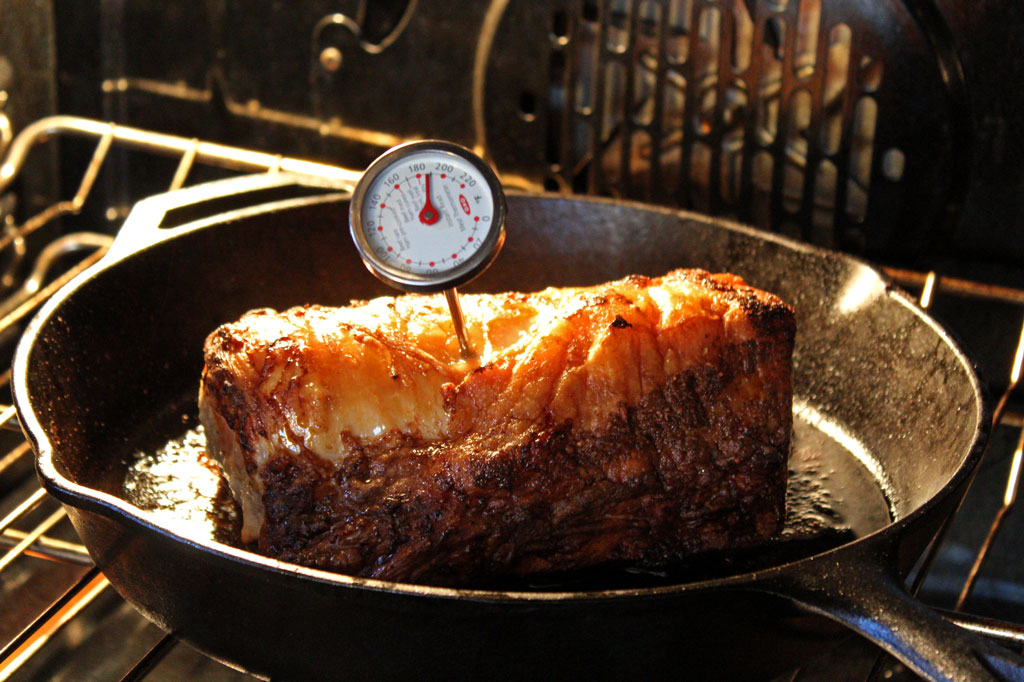 taking temperature of roast