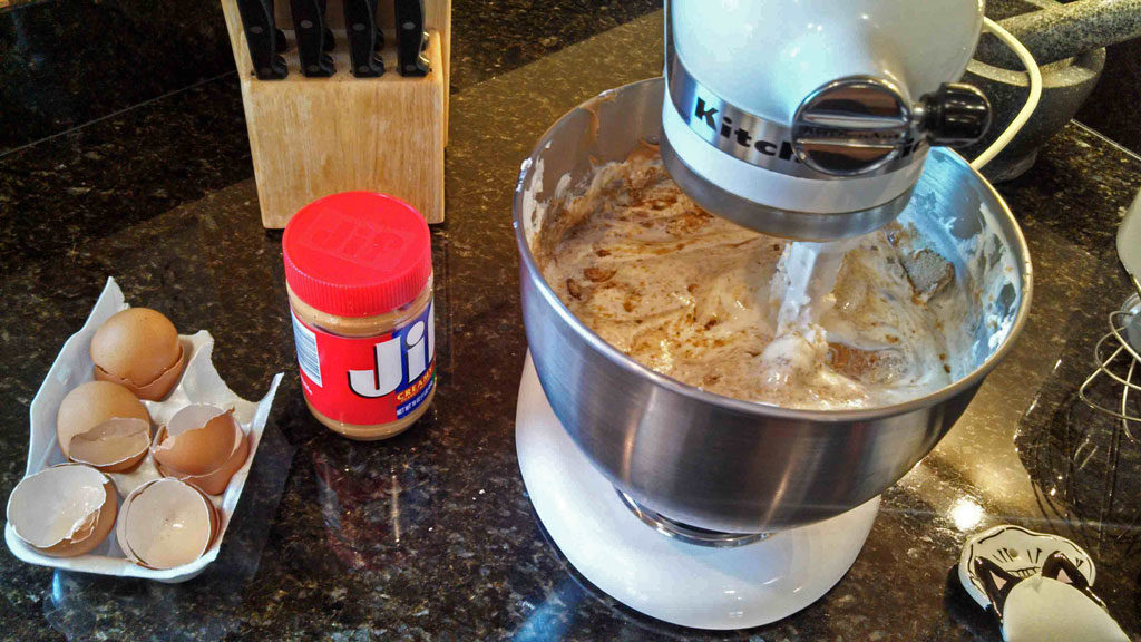 peanut butter added to peanut butter cheesecake filling in mixing bowl