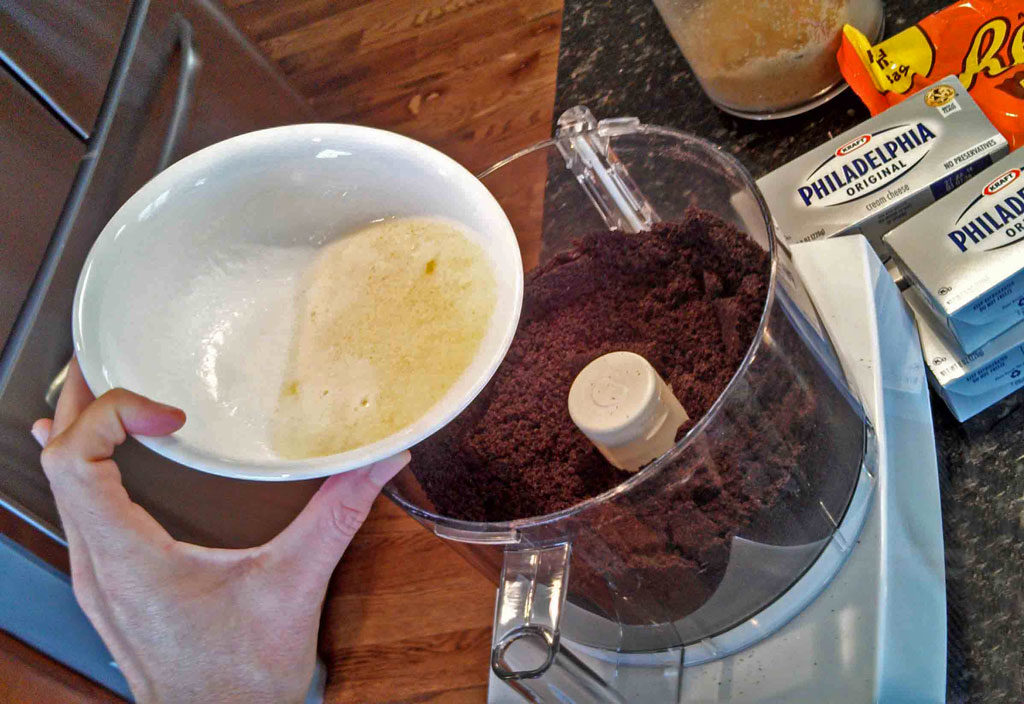 pouring butter into food processor
