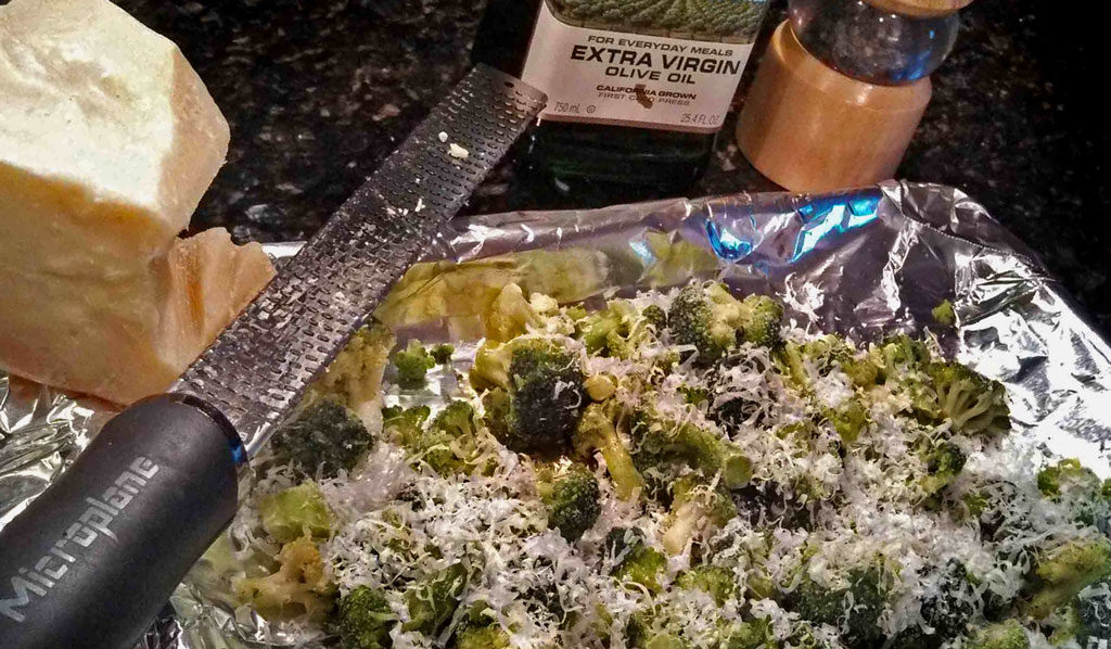This delicious roasted broccoli is drizzled with olive oil, salt and pepper and then sprinkled with fresh grated parmesan cheese, oven roasted until tender. | TheMountainKitchen.com
