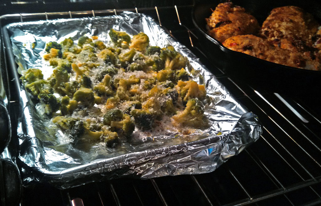 This delicious roasted broccoli is drizzled with olive oil, salt and pepper and then sprinkled with fresh grated parmesan cheese, oven roasted until tender. | TheMountainKitchen.com