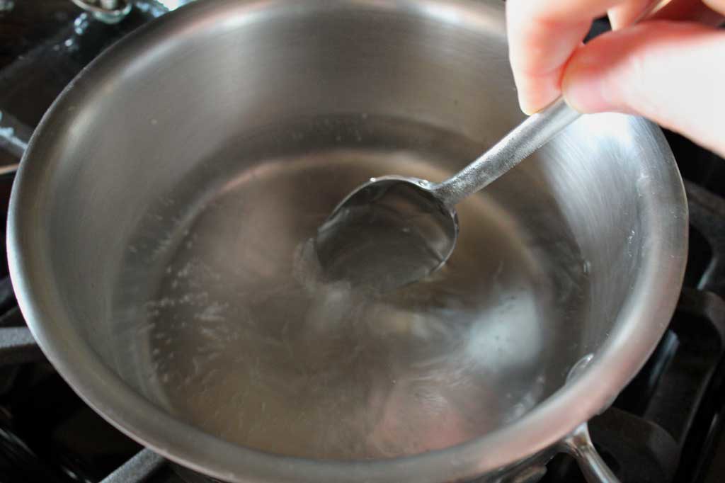 stirring water in pot