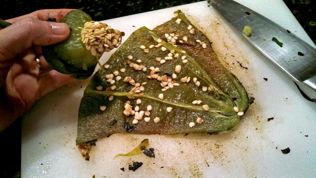 removing the stem and seeds from the flesh