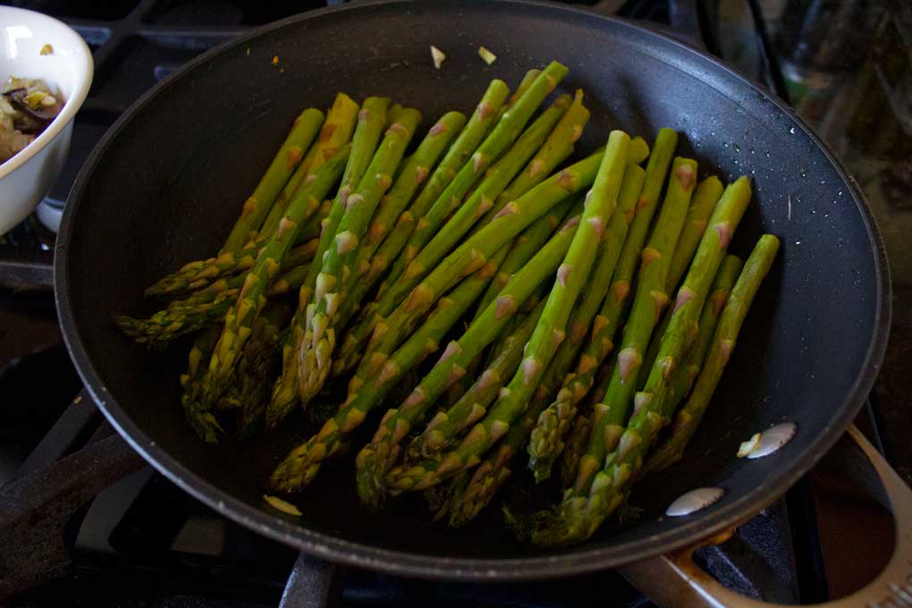 asparagus cooking in pan