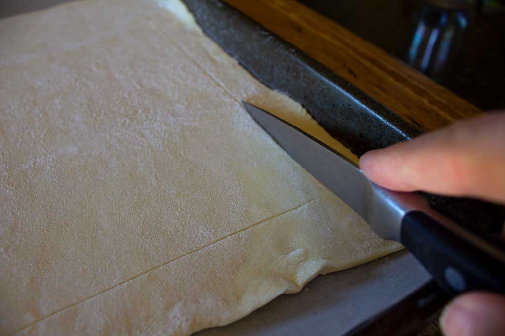scoring puff pastry with a knife