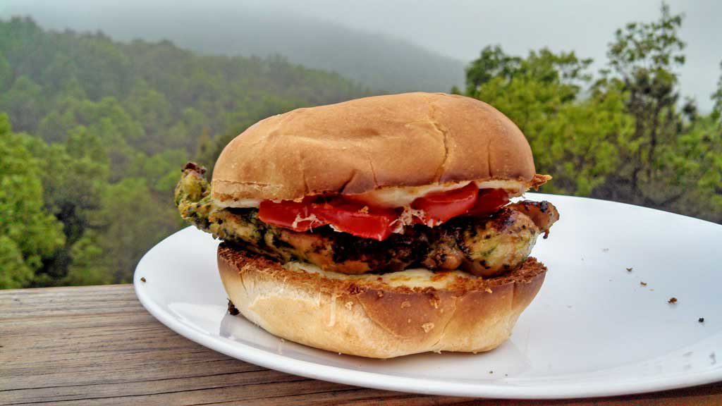 Grilled Cilantro Pesto Chicken Sandwiches are made with chicken marinated and grilled with a cilantro pesto with pine nuts, garlic and parsley, on a bun. | TheMountainKitchen.com