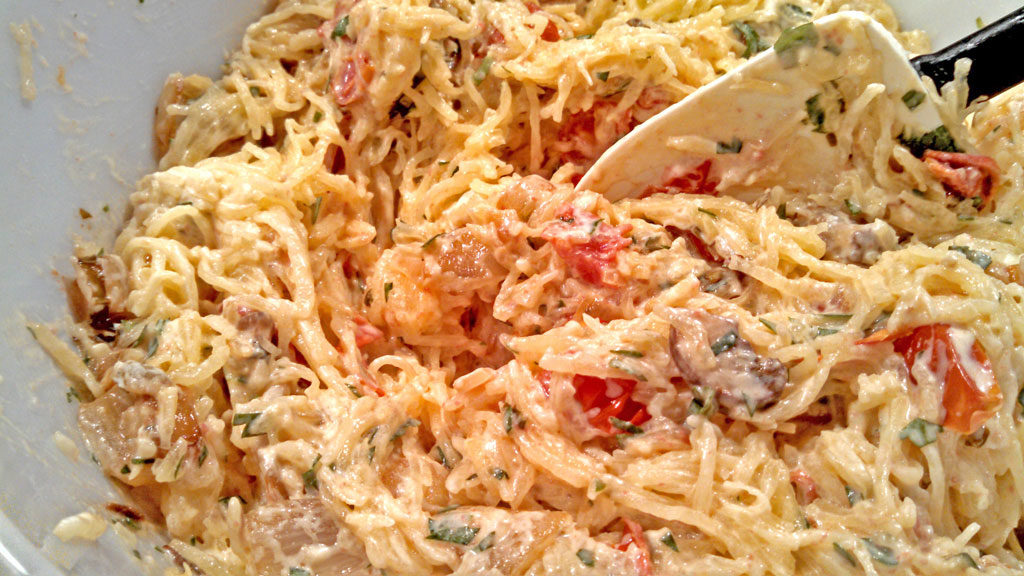Spaghetti Squash Casserole is a healthy and comforting way to prepare spaghetti squash mixed with mushrooms, tomatoes, onion, ricotta and mozzarella cheese.