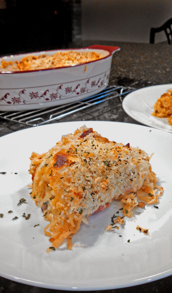 Spaghetti Squash Casserole is a healthy and comforting way to prepare spaghetti squash mixed with mushrooms, tomatoes, onion, ricotta and mozzarella cheese.
