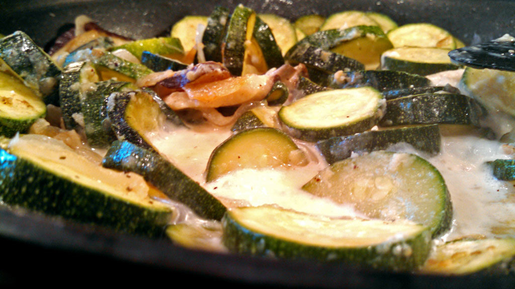 zucchini mushrooms and milk in skillet
