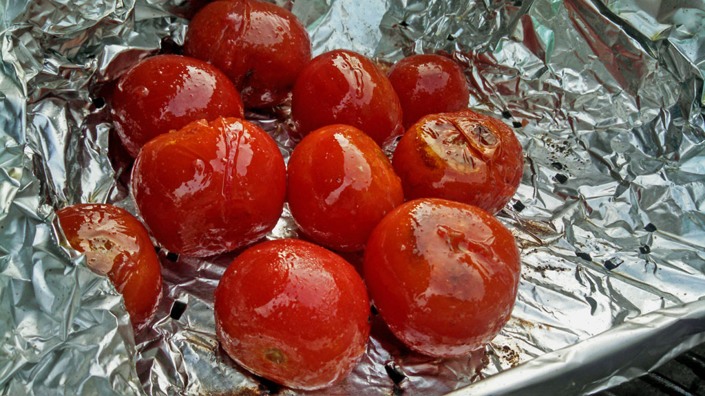 Instead of buying a grilling basket use aluminum foil. Shape the foil into the shape of a box, place on the grill, and poke holes in it. An inexpensive fix! | TheMountainKitchen.com
