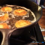 fried green tomatoes in cast iron pan