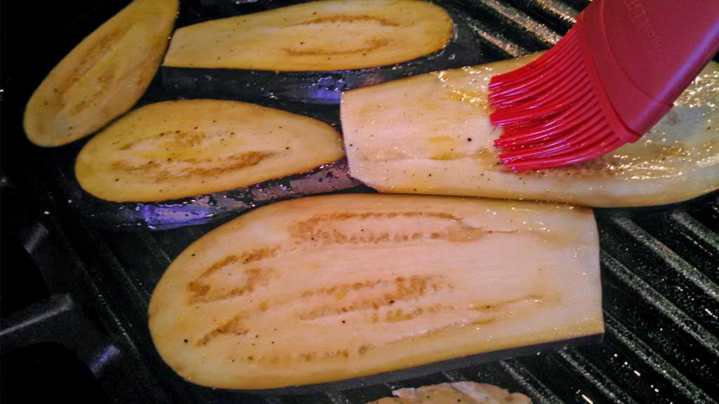 These grilled eggplant slices are salted to eliminate the bitterness. Brushed with garlic, olive oil and seasoned with salt and pepper and grilled. | TheMountainKitchen.com