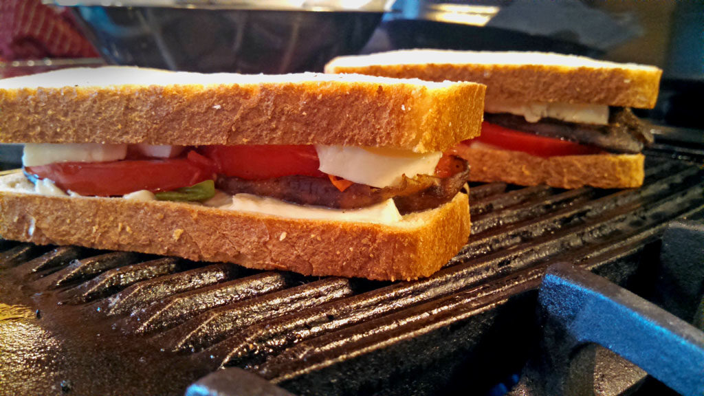 Grilled Mushroom Caprese Sandwiches are made with tomatoes, grilled mushrooms, fresh mozzarella cheese and basil filled inside rustic sourdough bread. Yum! | TheMountainKitchen.com