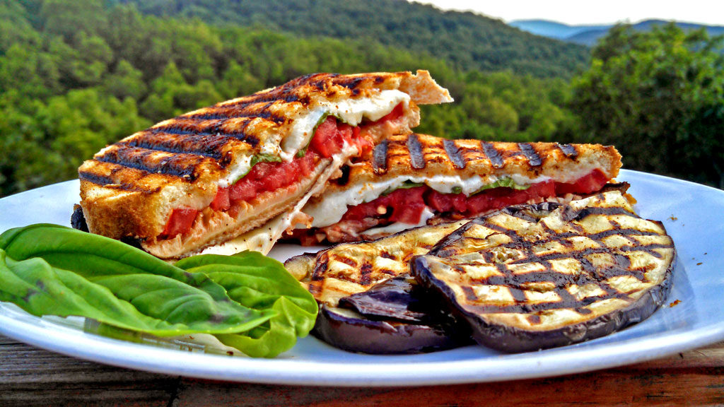 Grilled Mushroom Caprese Sandwiches are made with tomatoes, grilled mushrooms, fresh mozzarella cheese and basil filled inside rustic sourdough bread. Yum! | TheMountainKitchen.com