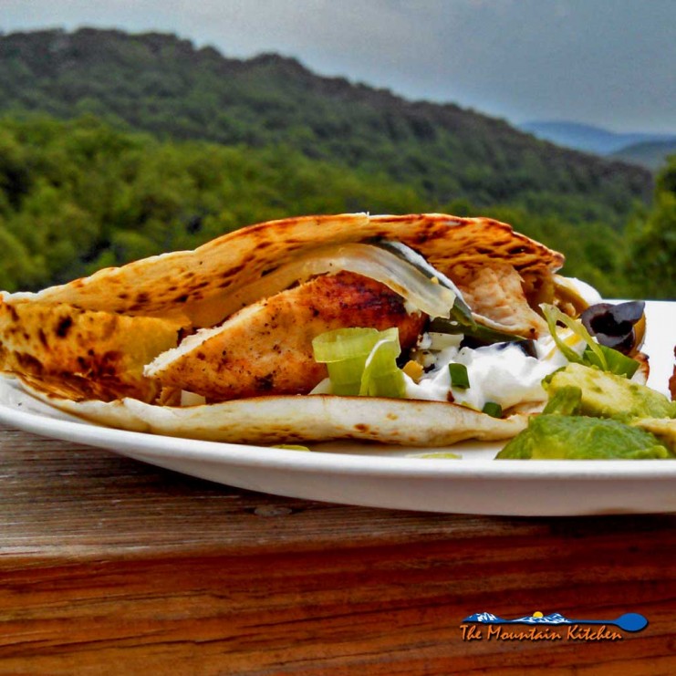 Grilled tequila-lime chicken fajitas: chicken breasts marinated in Mexican flavors, grilled, and placed inside a toasted tortilla with unlimited toppings. | TheMountainKitchen.com