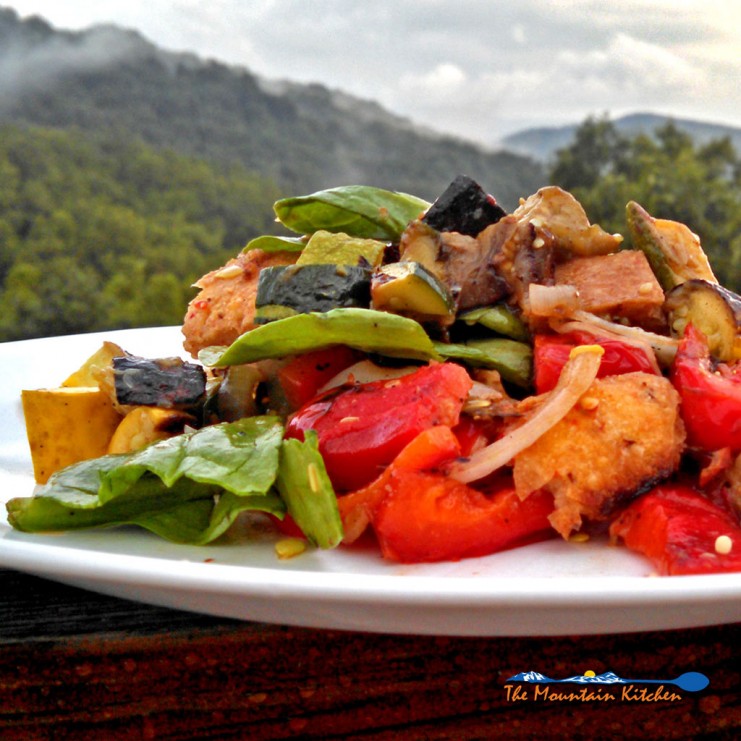 Summer squash, eggplant, zucchini, bell pepper, mushrooms and tomatoes all grilled to make a warm grilled vegetable salad with bread and dressing. | TheMountainKitchen.com