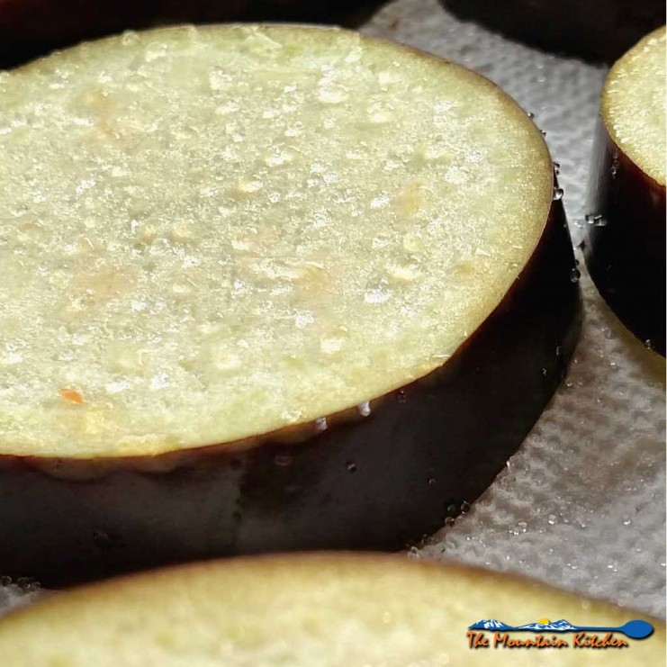 Salting eggplant draws out juices, tightens and firms up the flesh, making the eggplant less likely to soak up as much oil and of course, salt adds flavor. | TheMountainKitchen.com