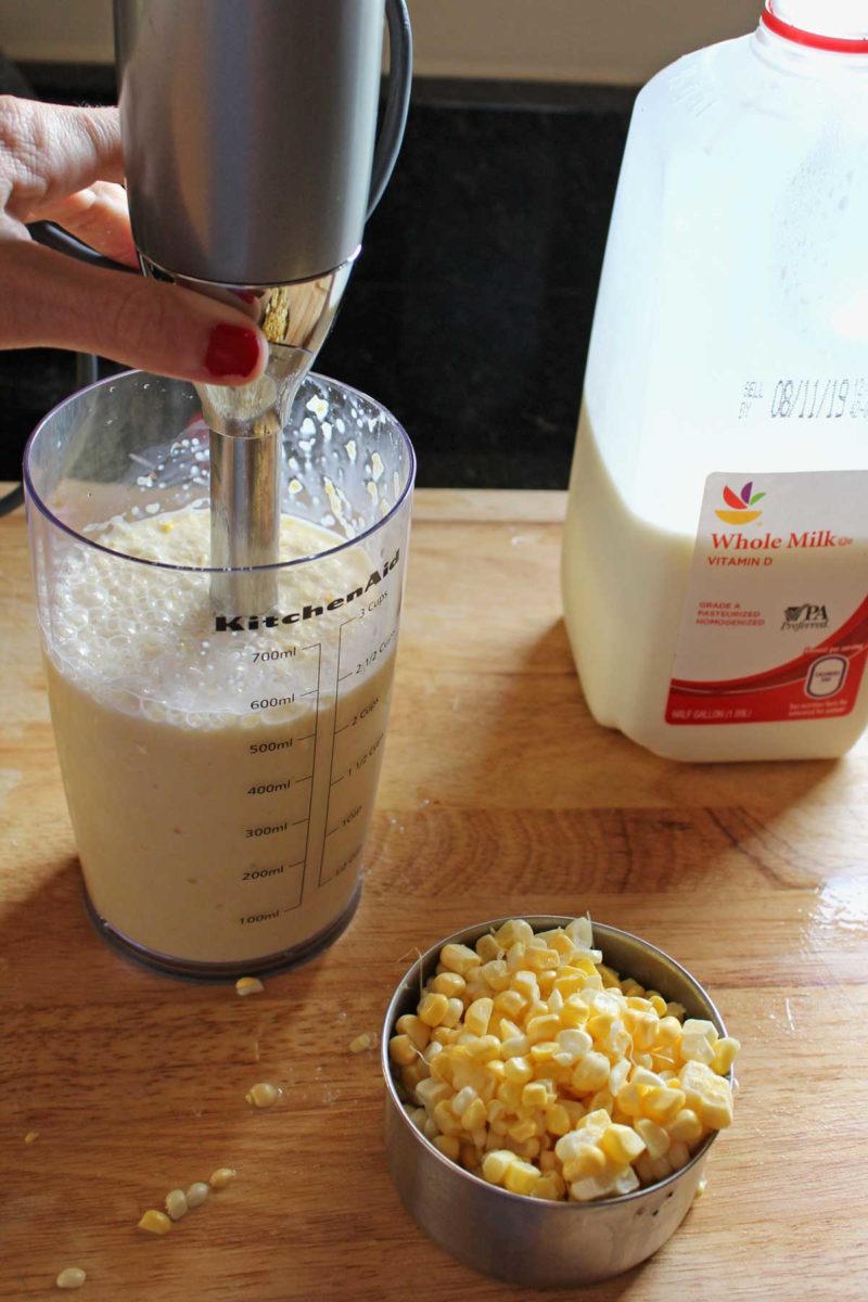 immersion blender blending milk and corn