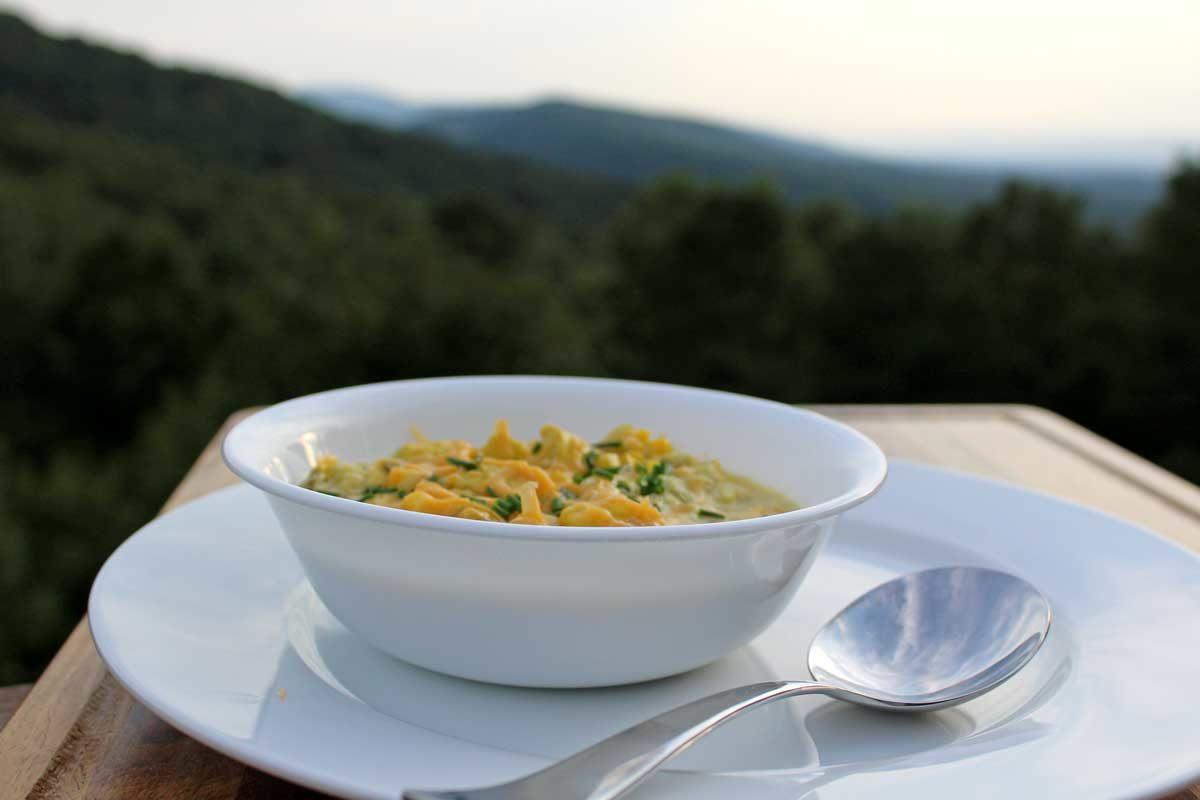 summer chowder in bowl with mountain view
