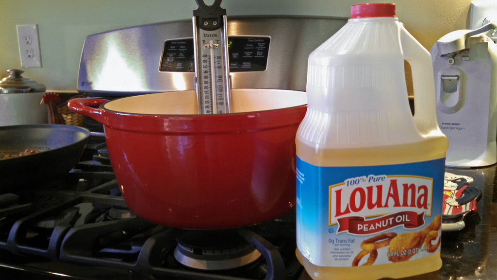 peanut oil and cast iron pot with thermometer