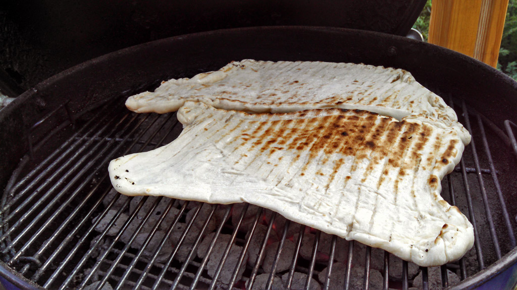 pizza dough on grill