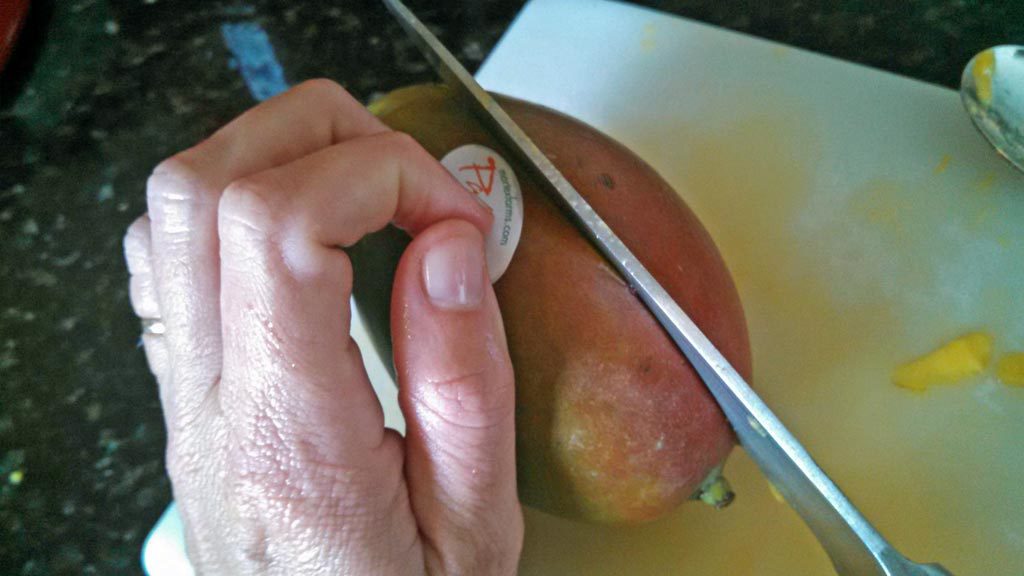 slicing knife into mango