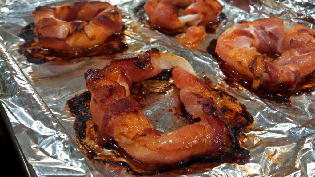 Bacon Onion Burger Crowns ~ Slices of crispy, smokey bacon wrapped around sweet onion rings grilled or baked to make the perfect crown for your next burger. | TheMountainKitchen.com