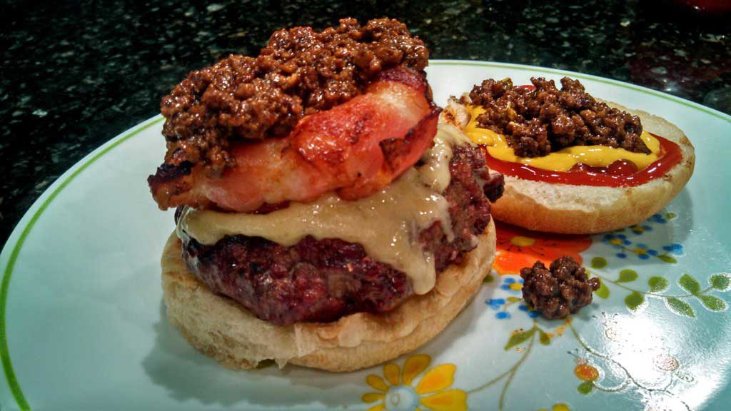 Bacon Onion Burger Crowns ~ Slices of crispy, smokey bacon wrapped around sweet onion rings grilled or baked to make the perfect crown for your next burger. | TheMountainKitchen.com