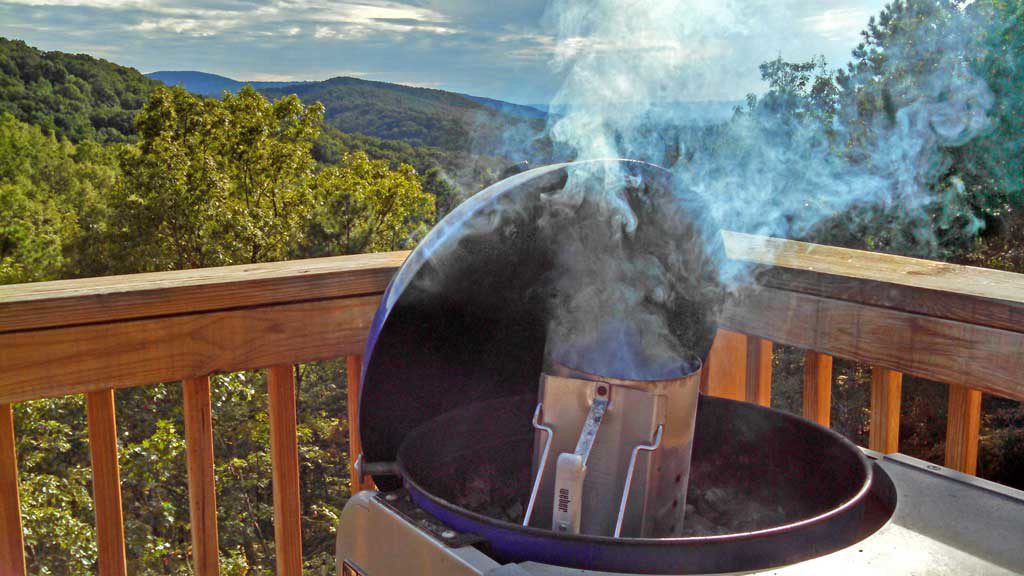 Beer Can Chicken is flavored with rosemary garlic orange butter sauce with garlic, slow cooked on the grill until tender, moist and falling-off-the-bone. | TheMountainKitchen.com
