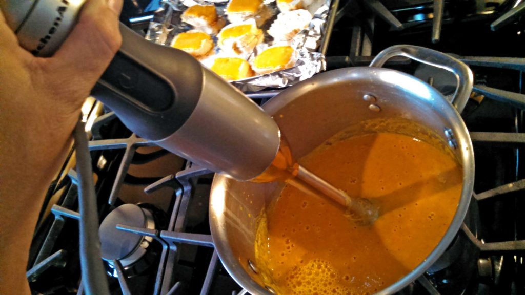 immersion blender blending soup in pot