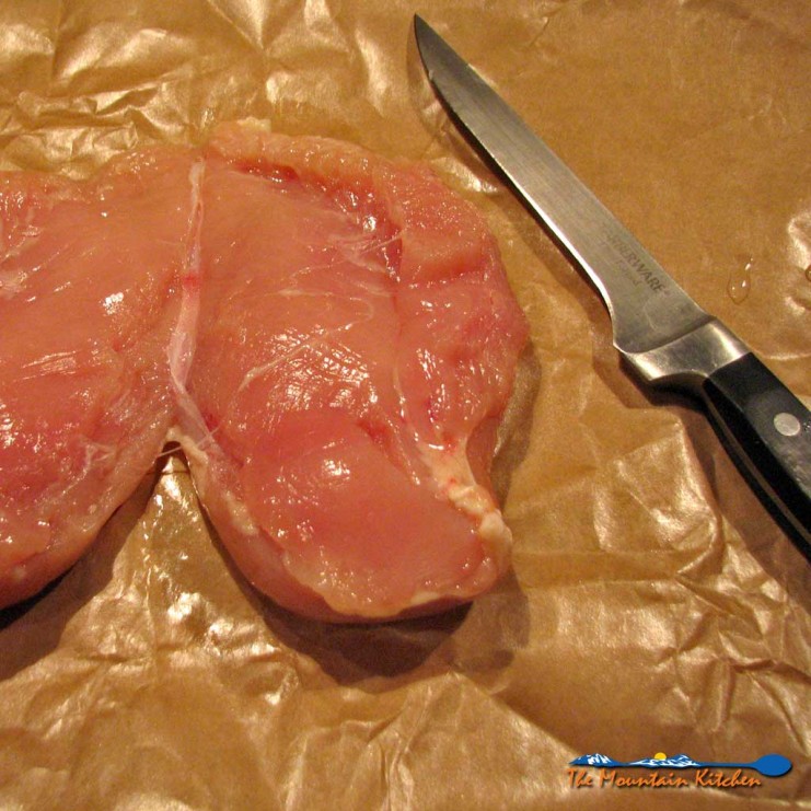 Learn how to fillet a whole chicken breast for even cooking and keeps you from having to cut the chicken into portions losing the juiciness of the chicken. | TheMountainKitchen.com