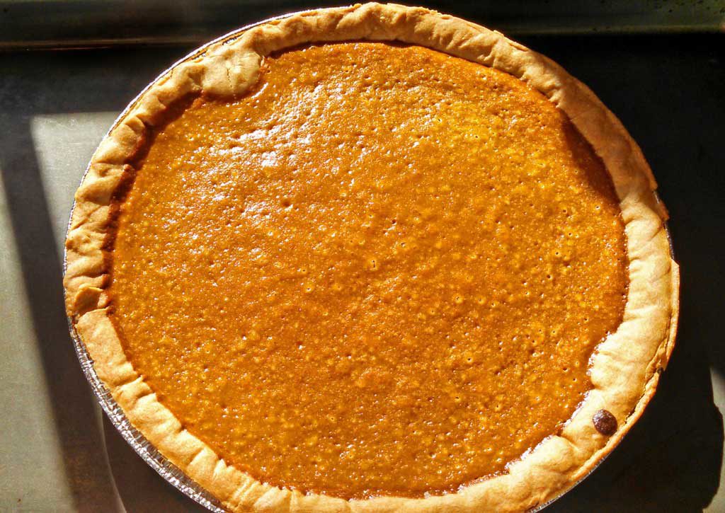 homemade pumpkin pie cooling