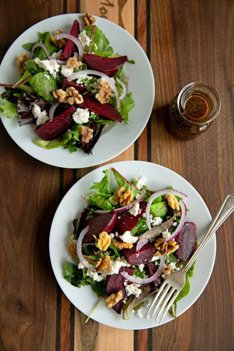roasted beet salads on plates ready to eat