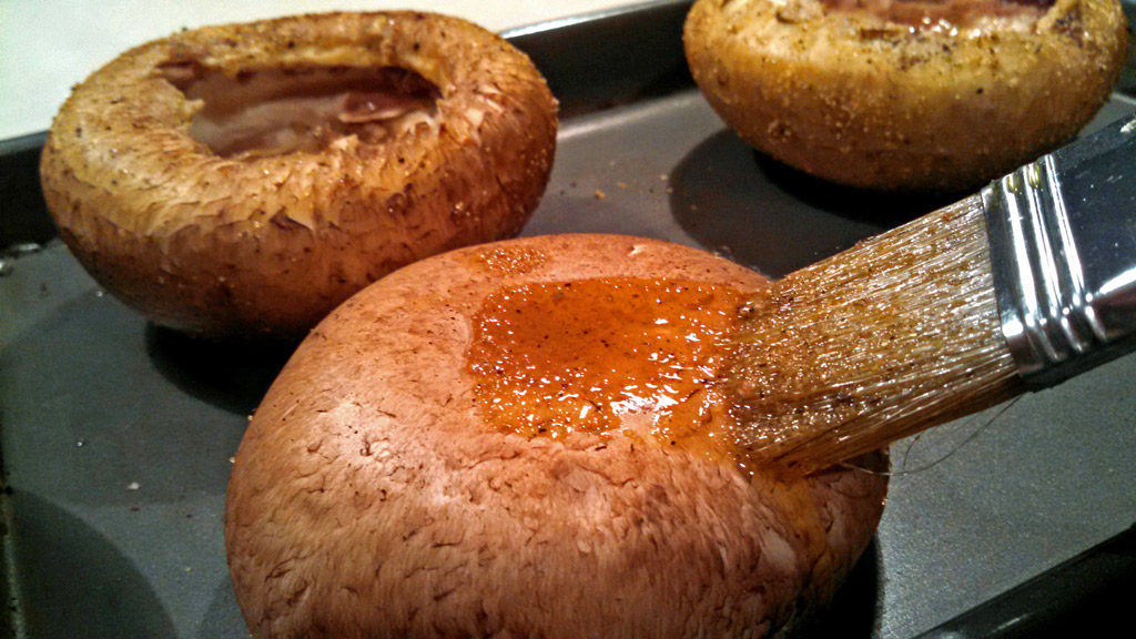 brushing mushrooms with oil mixture