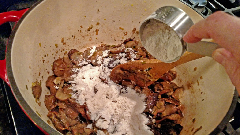 adding flour to the pot