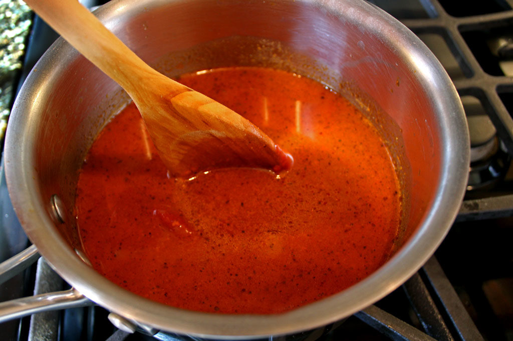 stirring enchilada sauce