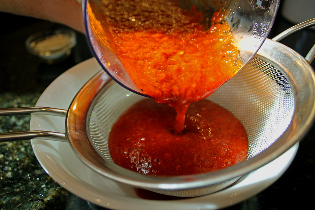 pour enchilada sauce into sieve