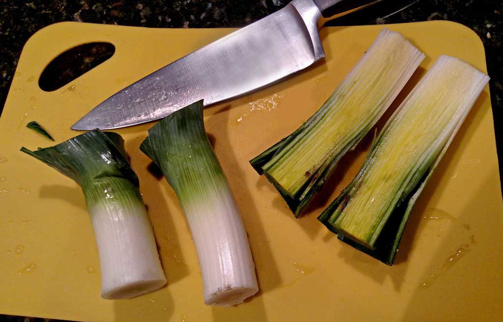 Leeks on cutting board with knife