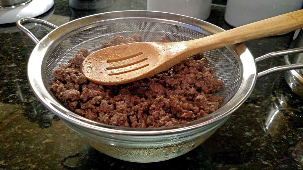 draining ground beef