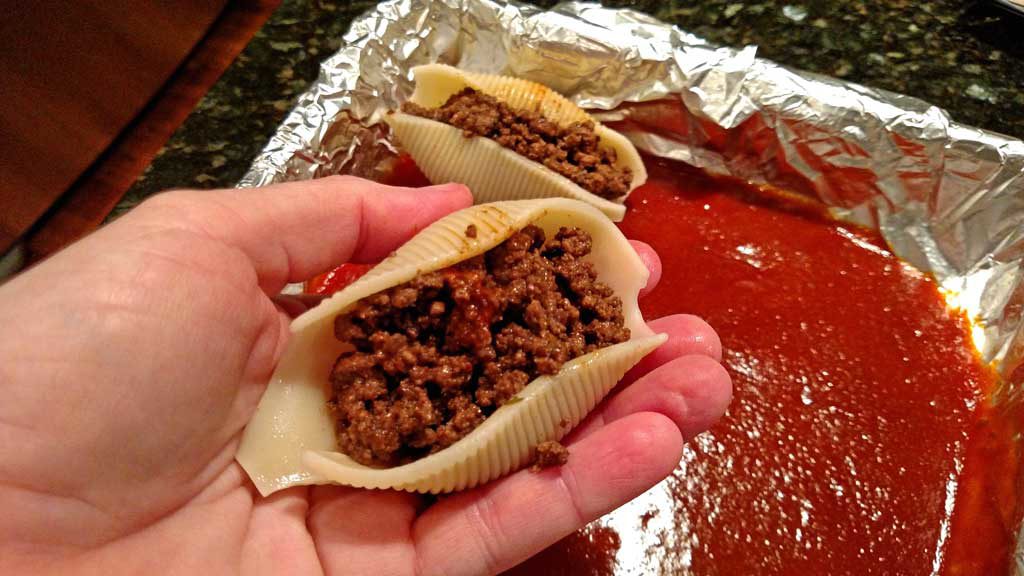stuffing shells with meat