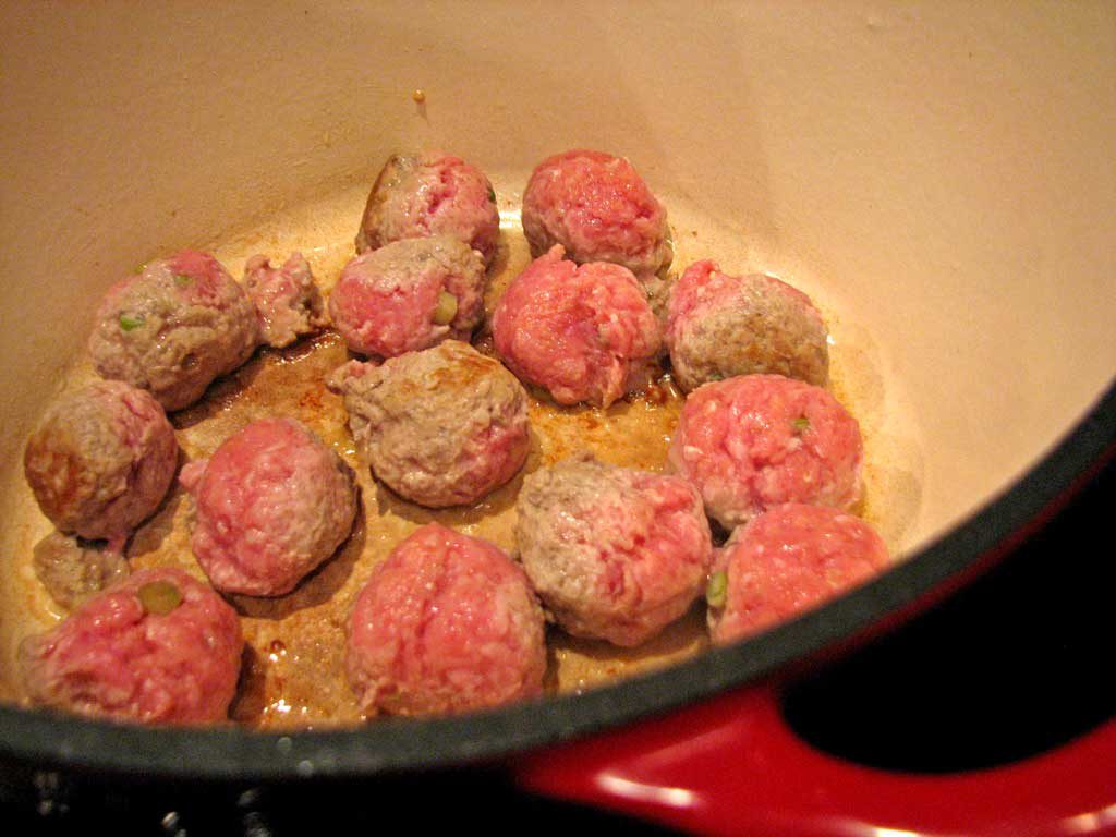 meatballs cooking in pot
