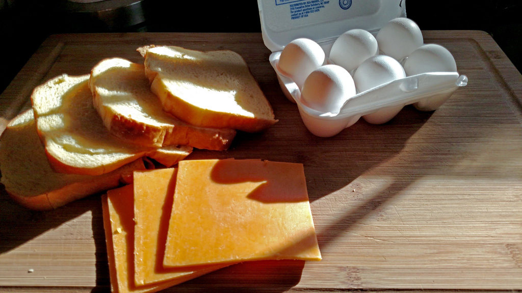Eggs in a basket is a quick and easy breakfast, these eggs are fried inside a hole cut into a slice of bread and topped with melted cheese. | TheMountainKitchen.com