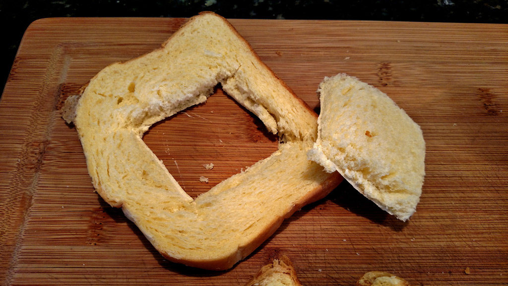 Eggs in a basket is a quick and easy breakfast, these eggs are fried inside a hole cut into a slice of bread and topped with melted cheese. | TheMountainKitchen.com
