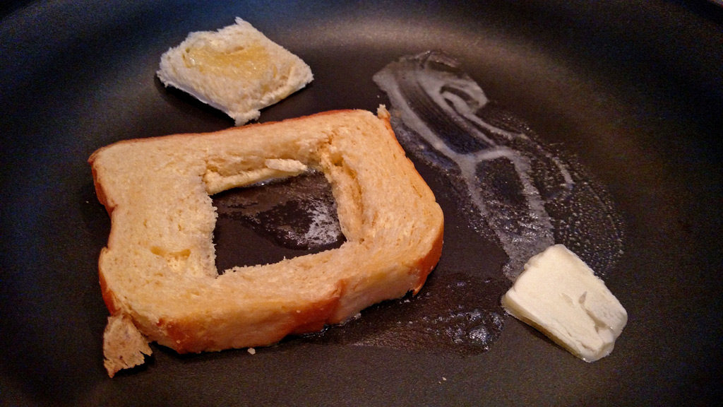 Eggs in a basket is a quick and easy breakfast, these eggs are fried inside a hole cut into a slice of bread and topped with melted cheese. | TheMountainKitchen.com