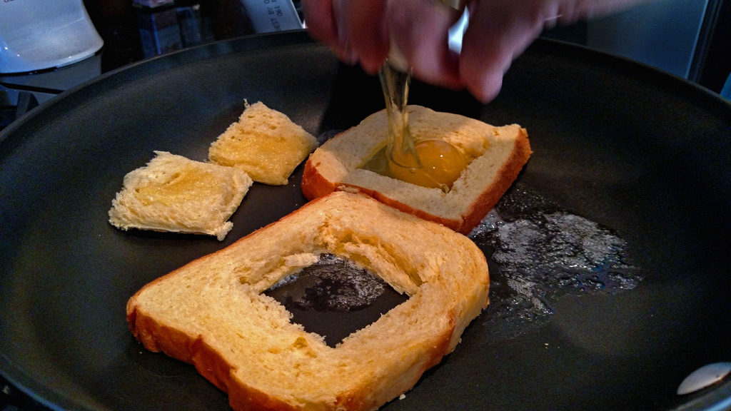 Eggs in a basket is a quick and easy breakfast, these eggs are fried inside a hole cut into a slice of bread and topped with melted cheese. | TheMountainKitchen.com