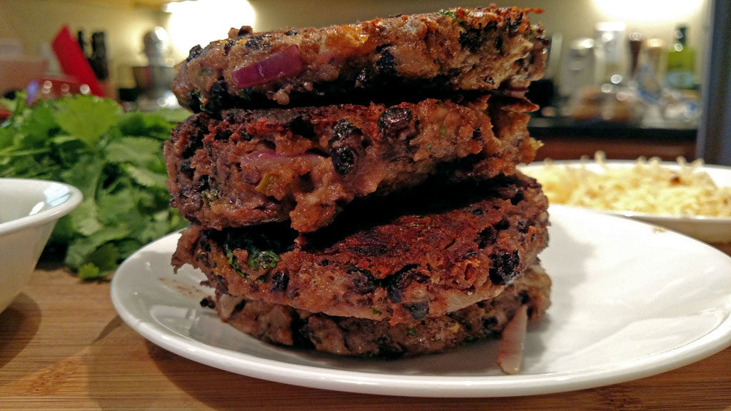 stack of pepper jack black bean burgers on plate