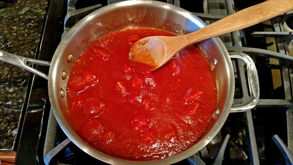 Basil, garlic, broth and tomato sauce all come together to create a delicious light sauce over Farfalle noodles and plump shrimp for this Shrimp Pomodoro. | TheMountainKitchen.com