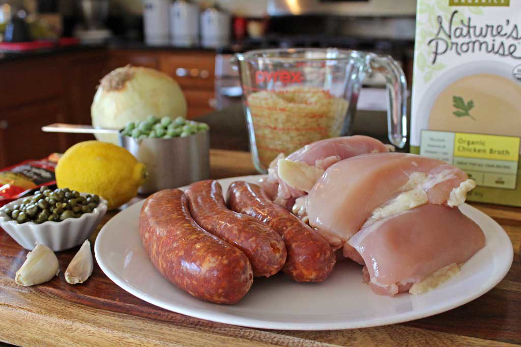 Perfect for a weeknight meal, this chicken with chorizo and rice comes together in less than an hour. Chorizo and fresh lemon juice set this dish off! | TheMountainKitchen.com