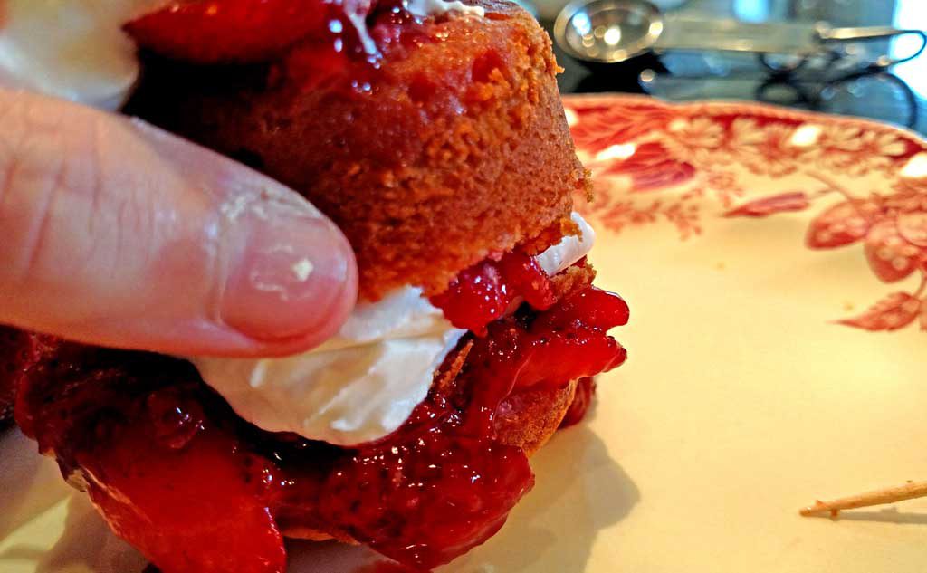 Strawberry Shortcake Surprise is made with light fluffy shortcake cupcakes covered in thick syrupy strawberry compote, fresh strawberries and whipped cream. | TheMountainKitchen.com